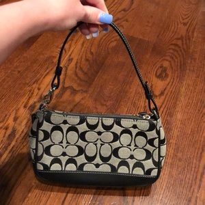 Black and gray coach logo shoulder bag